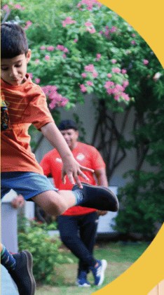 Child playing football on the Starseed lawn